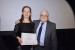 Dr. Nagib Callaos, General Chair, giving Dr. Maria Csernoch an award certificate in appreciation for his presentation oriented to inter-disciplinary communication entitled: "Do You Speak, Write, and Design in Informatics?."